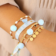 Schmucksets Pompon-Anhänger in Sommerschmuck einarbeiten