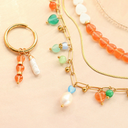 Schmucksets Designideen: Ohrringen und Halsketten mit Cat’s Eye-Glasperlen